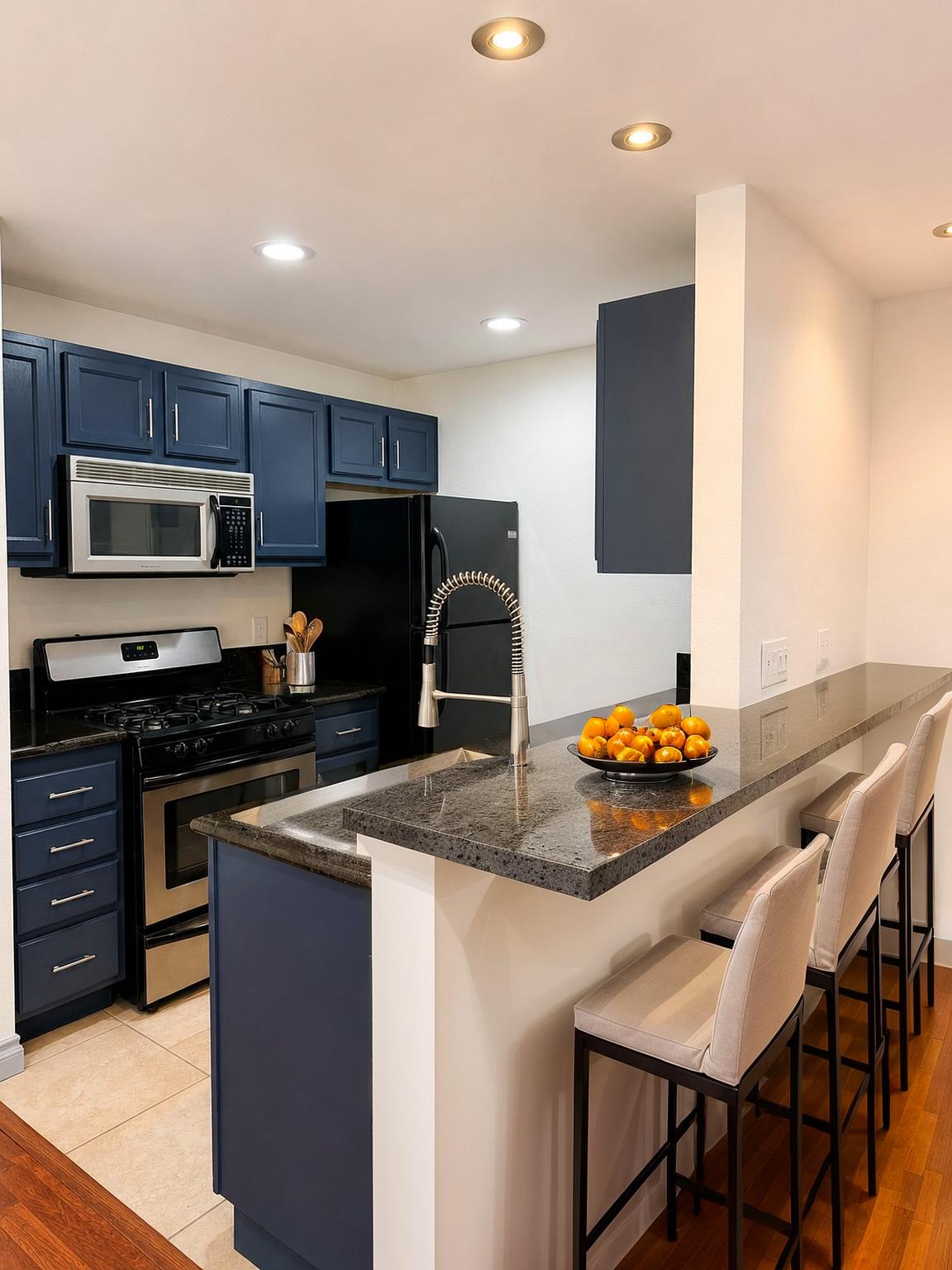 Residence 7 navy kitchen with granite breakfast counter