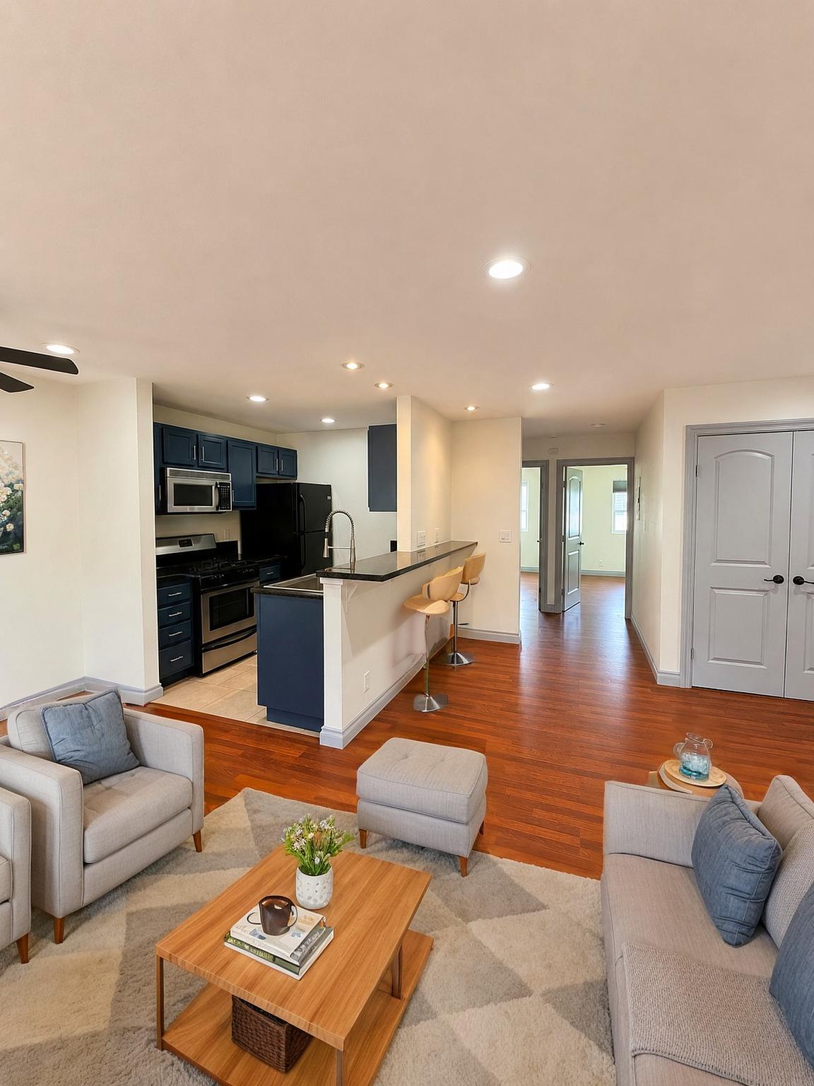 Residence 7 open living area and navy kitchen