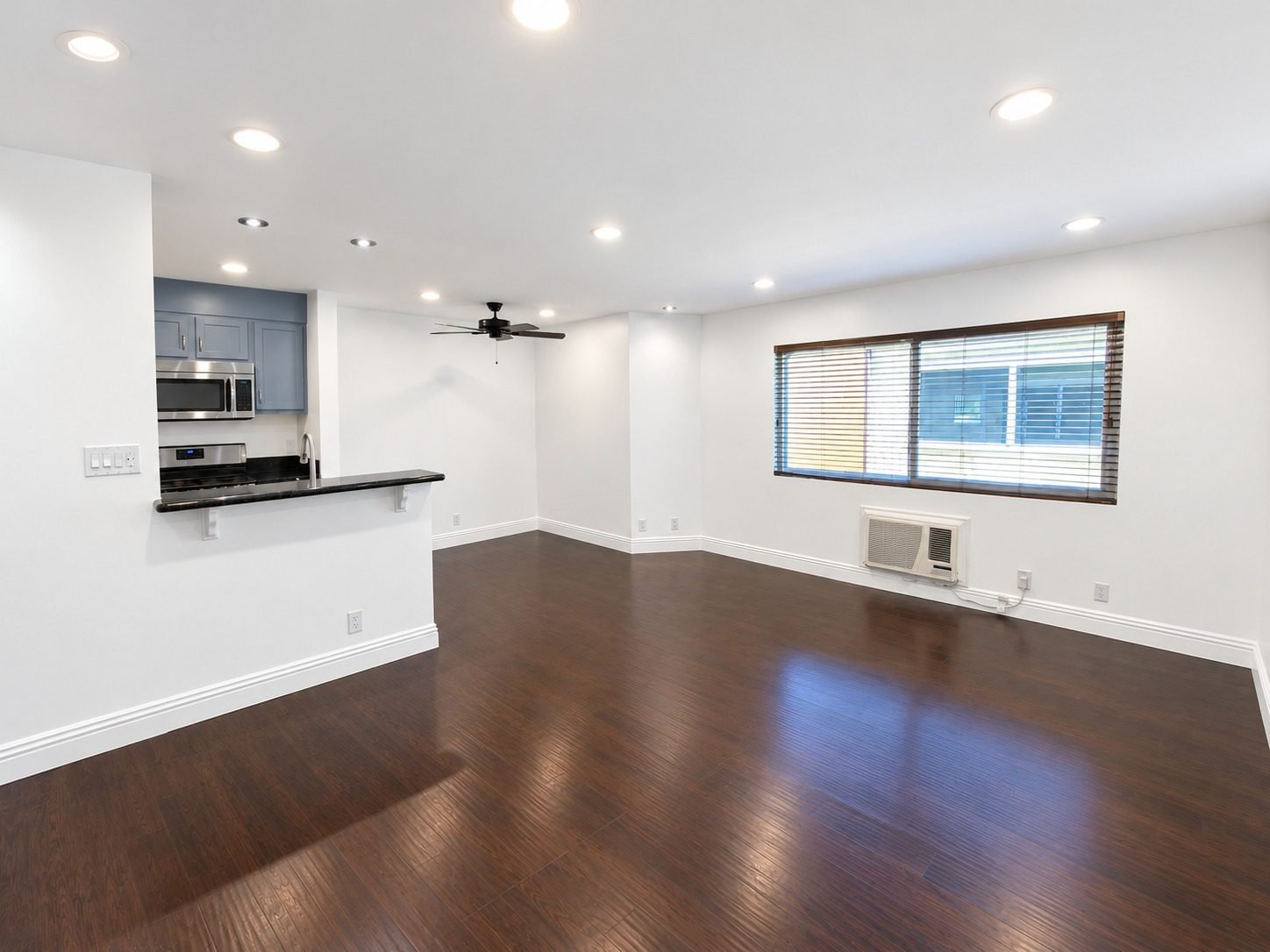 Residence 8 living room with open kitchen and wood-look floors